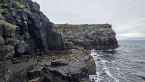 Dark volcanic cliffs and rocky shore on the Isle of May
